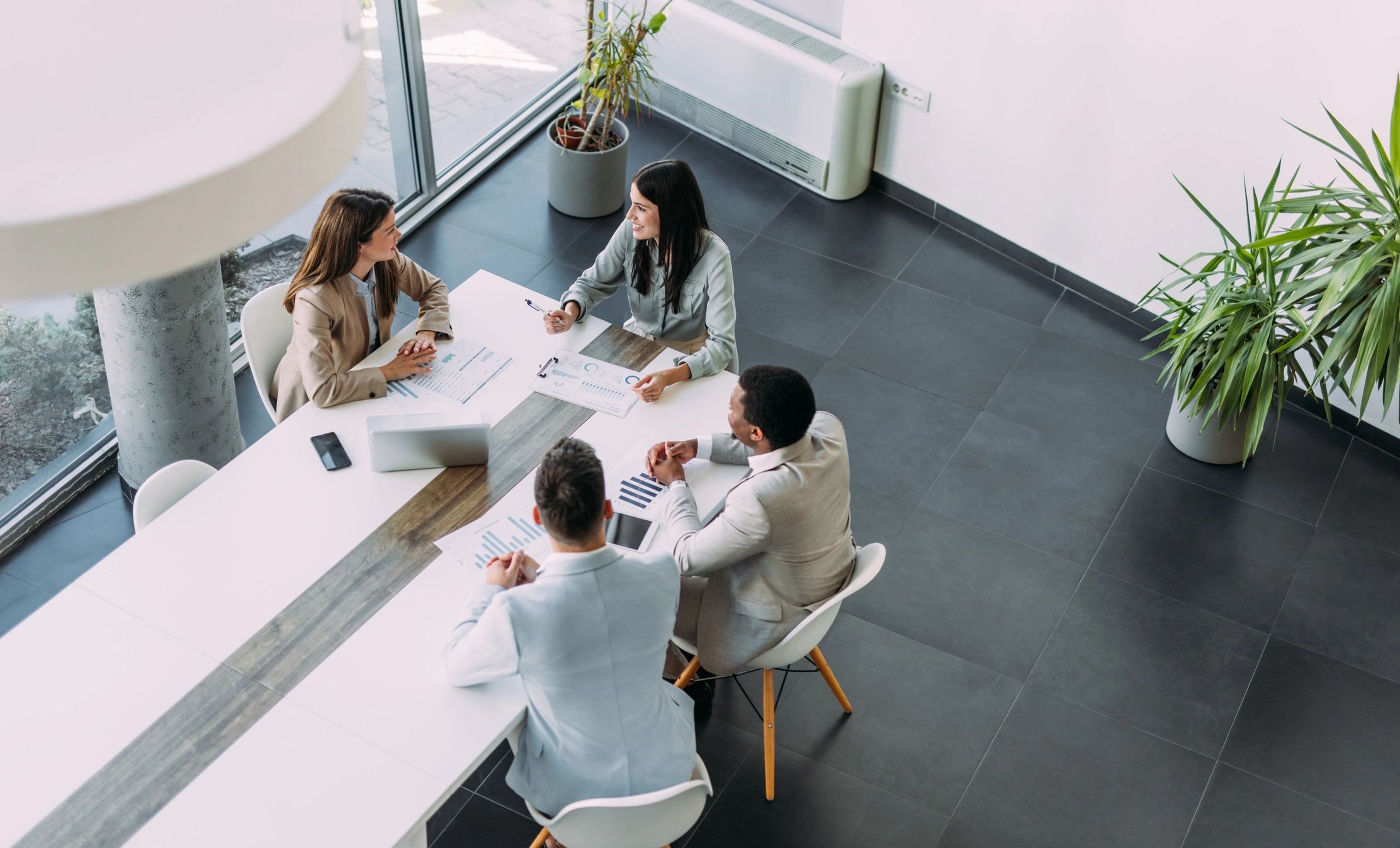 Professionals collaborating in a technology-focused meeting