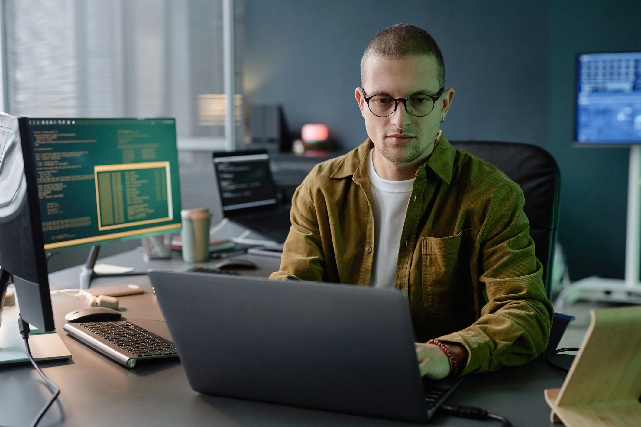 Developer working on a laptop in a modern office