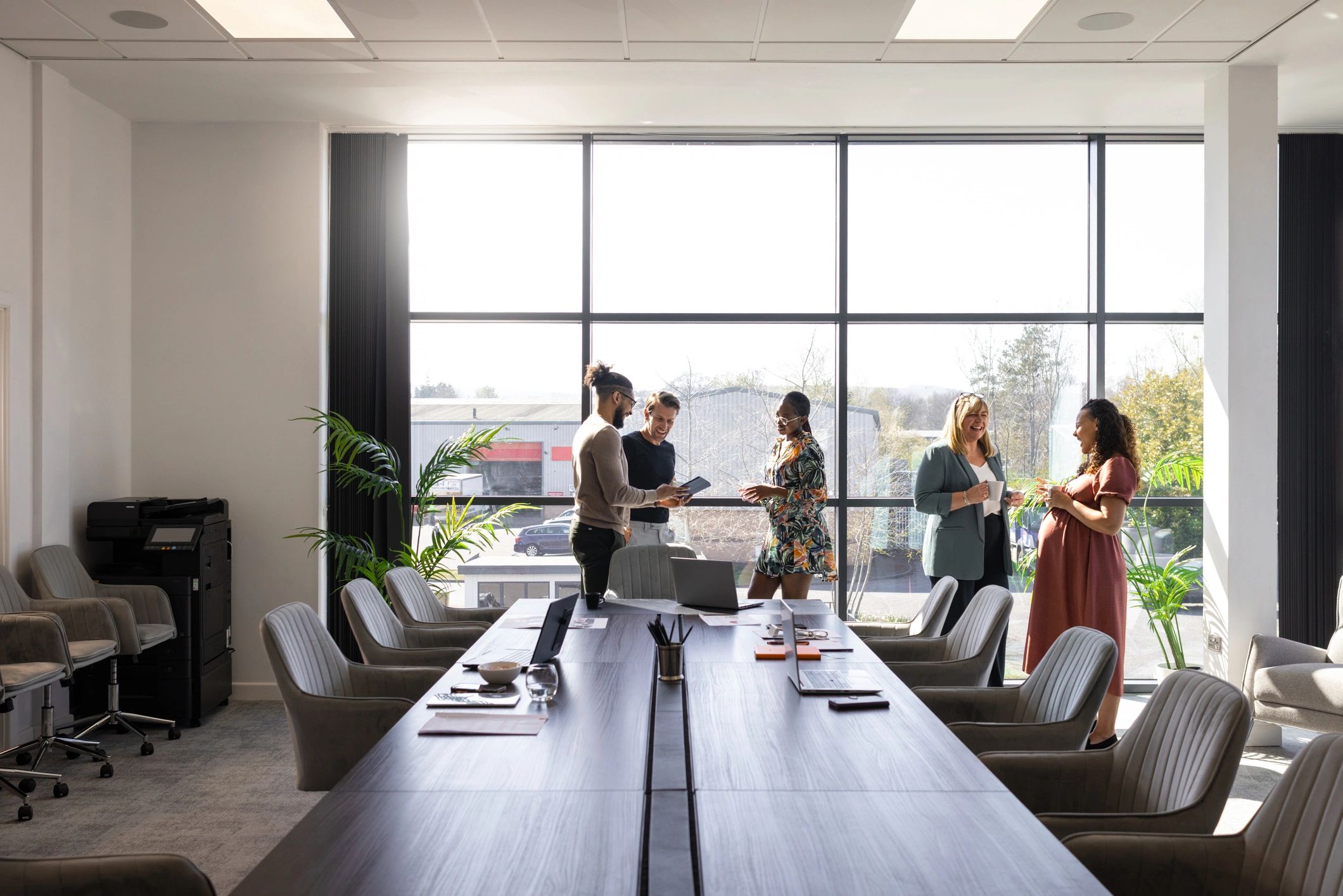 Business colleagues discussing ideas in a modern conference room